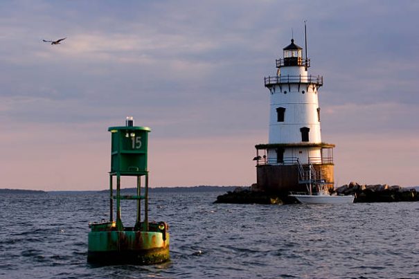 Conimicut Light at sunset. So-called "Spark plug" style light. Located in Narragansett Bay, off the coast of Warwick, RI. Taken from a boat.